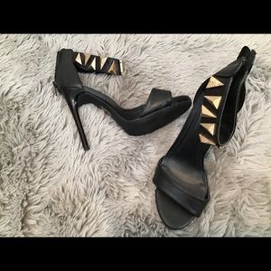 Black heels with ankle wrapped.